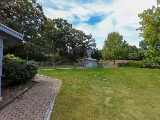 a view of a swimming pool with a yard