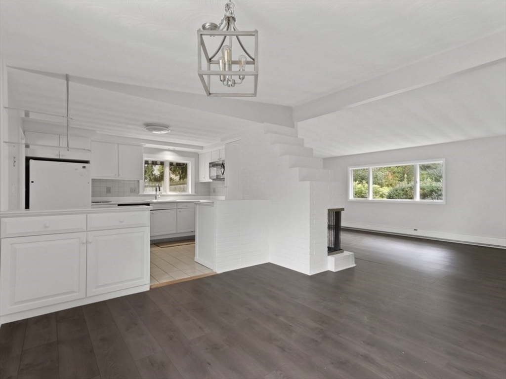 83 Joseph Road Framingham, MA 01701 - Photo 5 of 21 a kitchen with cabinets and wooden floor
