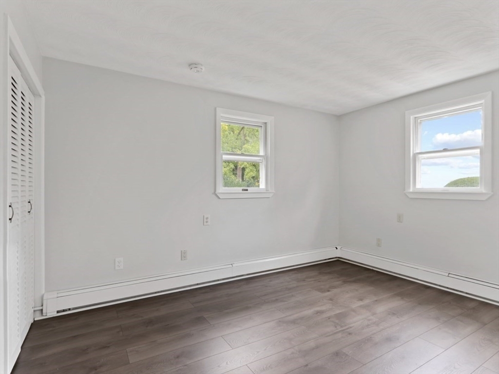 83 Joseph Road Framingham, MA 01701 - Photo 10 of 21 an empty room with wooden floor and window