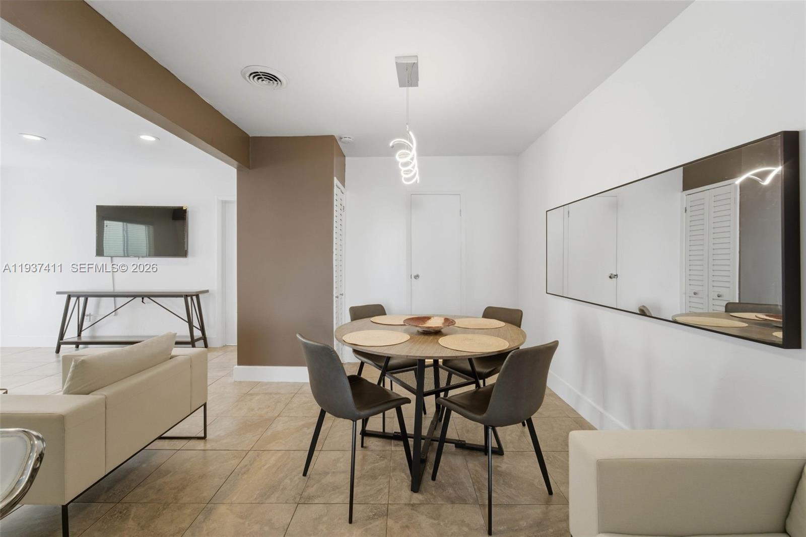 4420 Northwest 3rd Avenue Miami, FL 33127 - Photo 11 of 15 a dining room with furniture and window