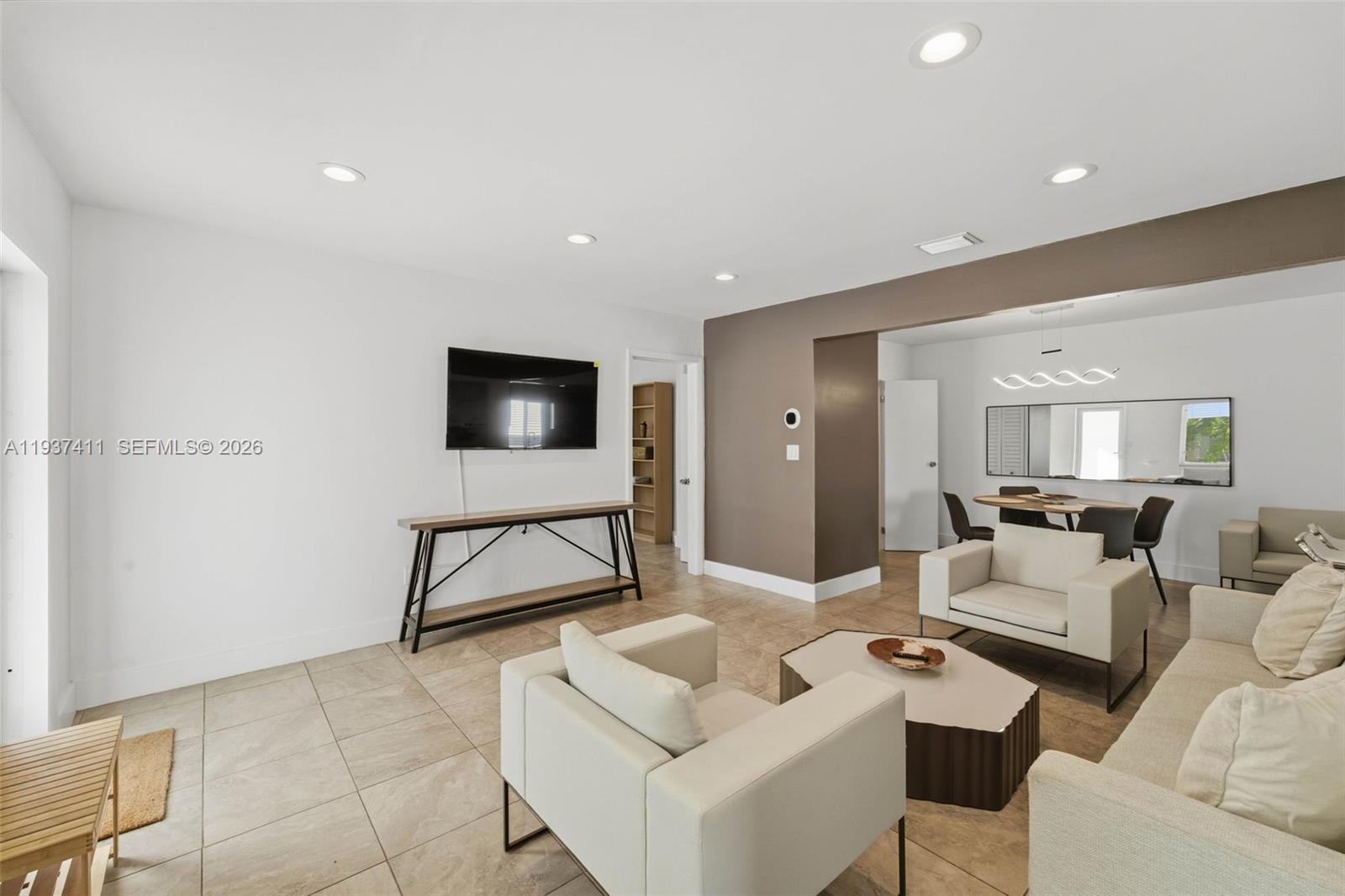 4420 Northwest 3rd Avenue Miami, FL 33127 - Photo 4 of 15 a living room with furniture and a flat screen tv