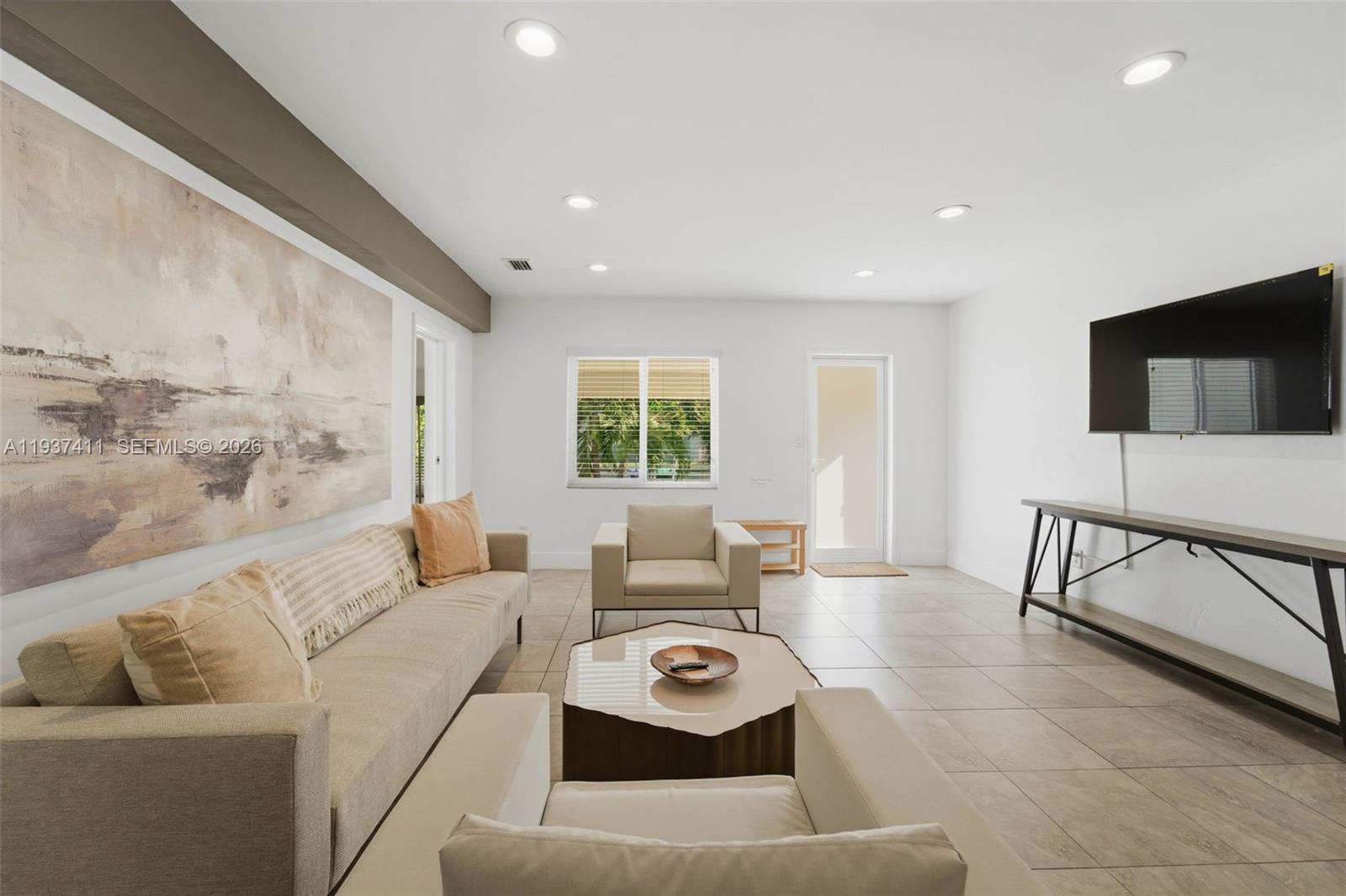 4420 Northwest 3rd Avenue Miami, FL 33127 - Photo 5 of 15 a living room with furniture and a flat screen tv