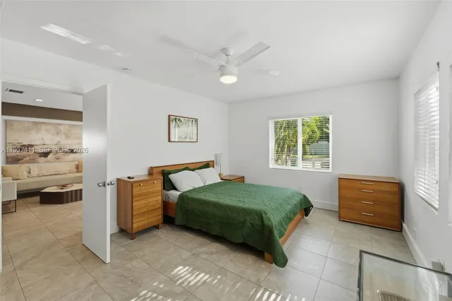 a bedroom with a bed and a couch