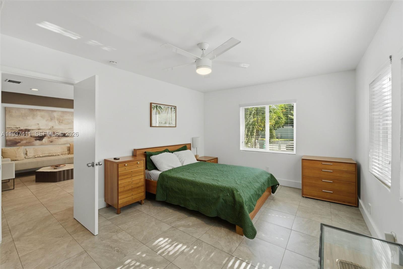 4420 Northwest 3rd Avenue Miami, FL 33127 - Photo 6 of 15 a bedroom with a bed and a couch