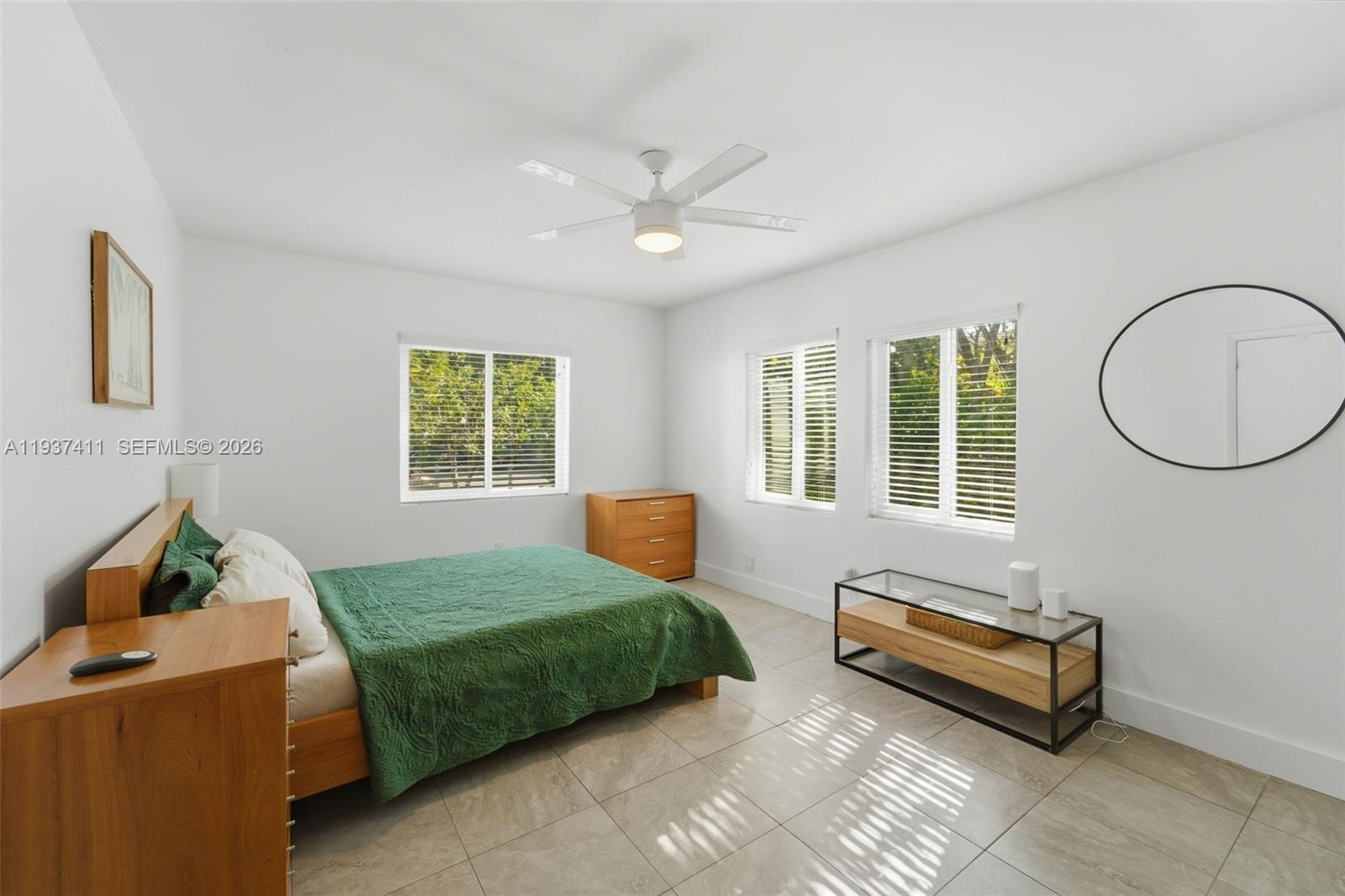 4420 Northwest 3rd Avenue Miami, FL 33127 - Photo 7 of 15 a bedroom with a bed a table and window