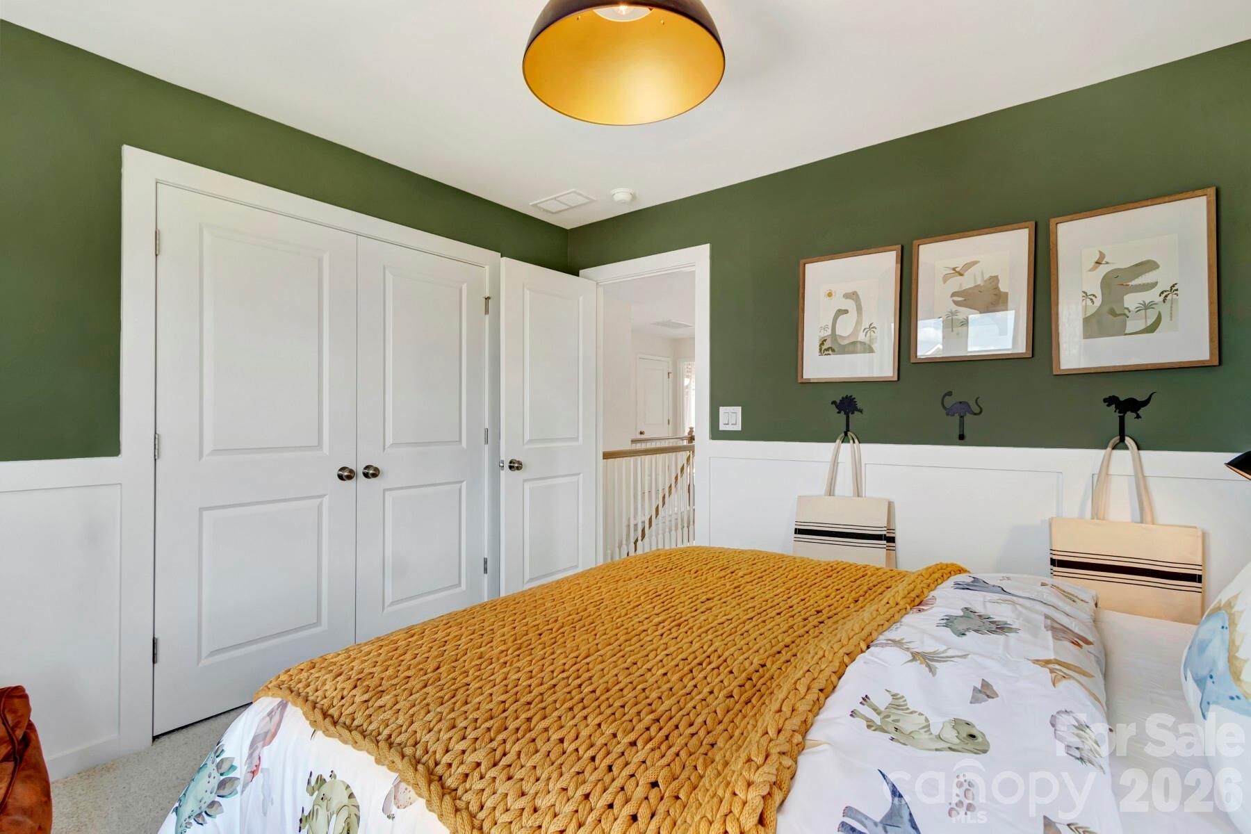 1452 Kate Cecil Way York, SC 29745 - Photo 17 of 27 a bedroom with a bed and a chandelier