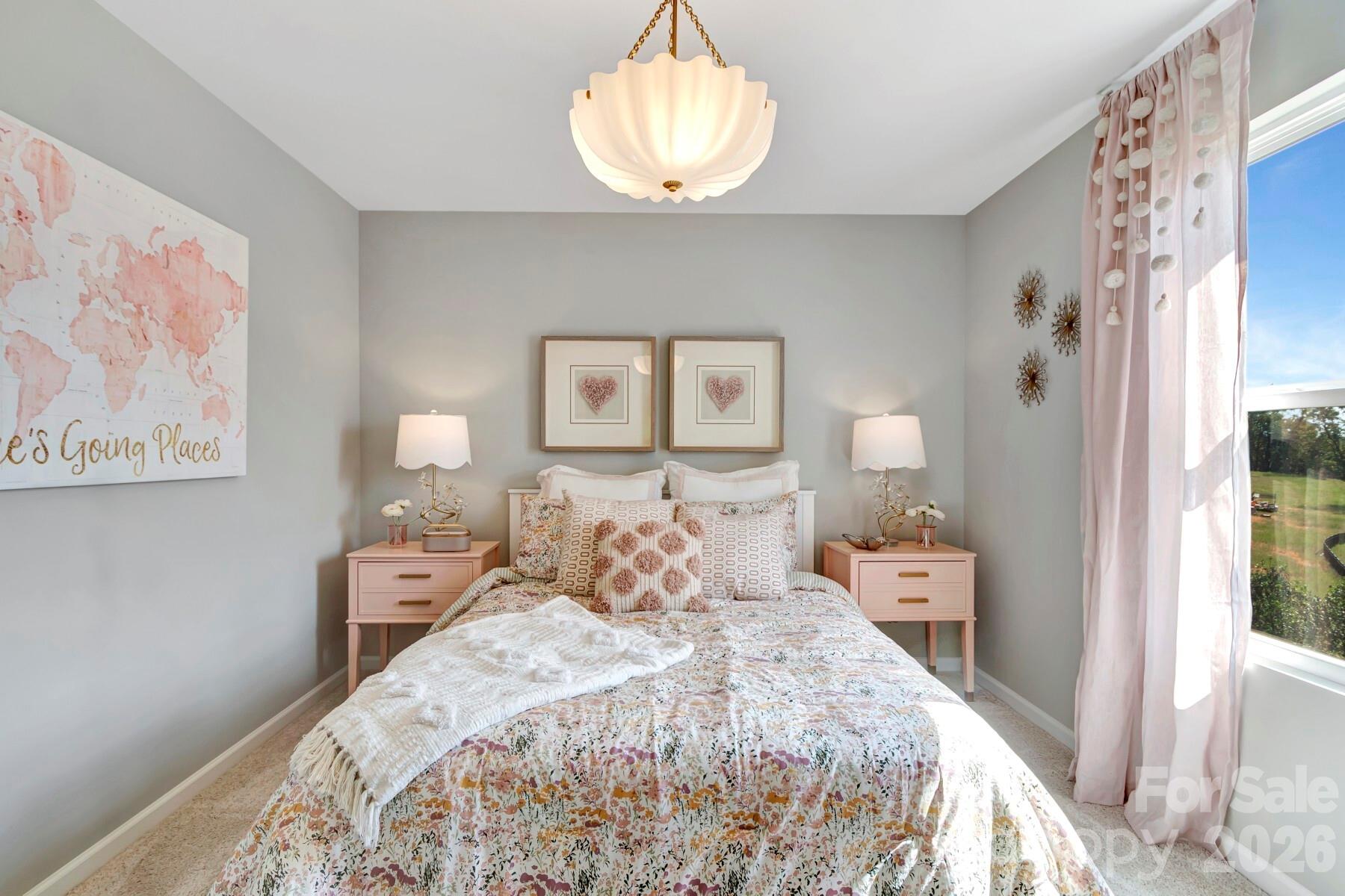 1452 Kate Cecil Way York, SC 29745 - Photo 18 of 27 a bedroom with bed and a painting on the wall