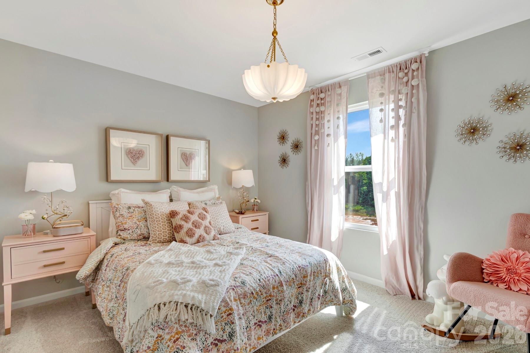 1452 Kate Cecil Way York, SC 29745 - Photo 19 of 27 a bedroom with a bed and a window