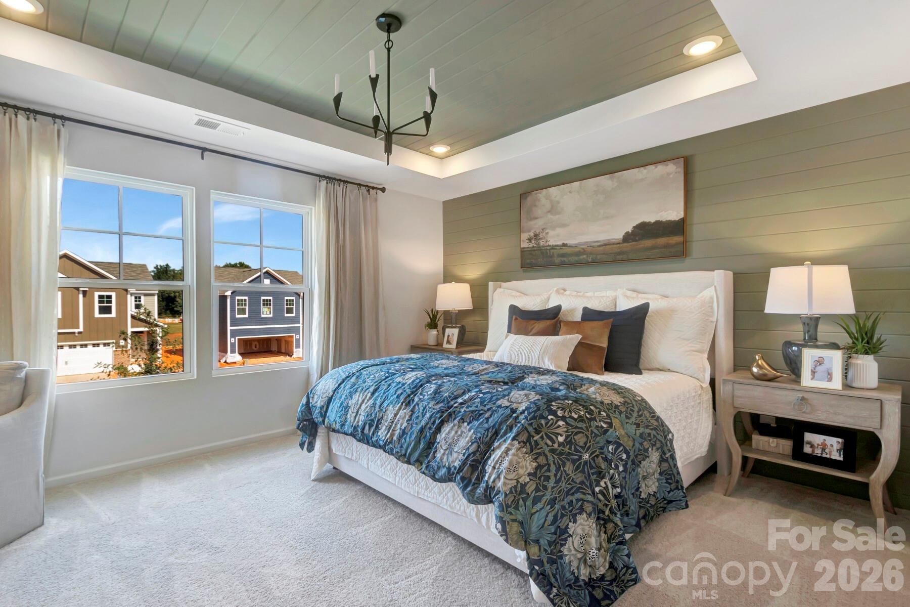 1452 Kate Cecil Way York, SC 29745 - Photo 23 of 27 a spacious bedroom with a bed window and wall painting