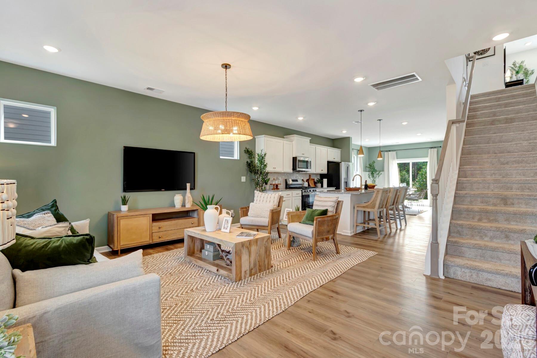 1452 Kate Cecil Way York, SC 29745 - Photo 4 of 27 a living room with furniture flat screen tv and a fireplace