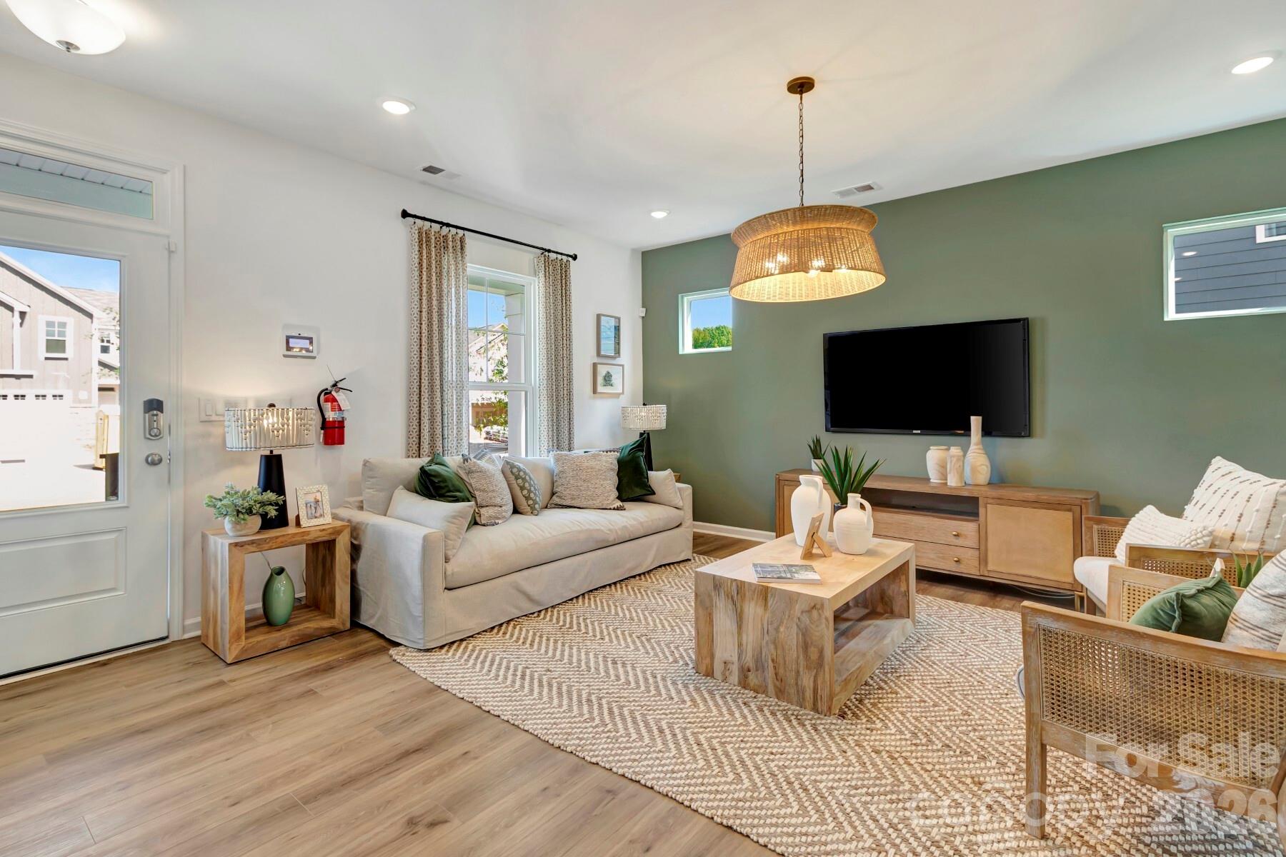 1452 Kate Cecil Way York, SC 29745 - Photo 6 of 27 a living room with furniture a flat screen tv and a window