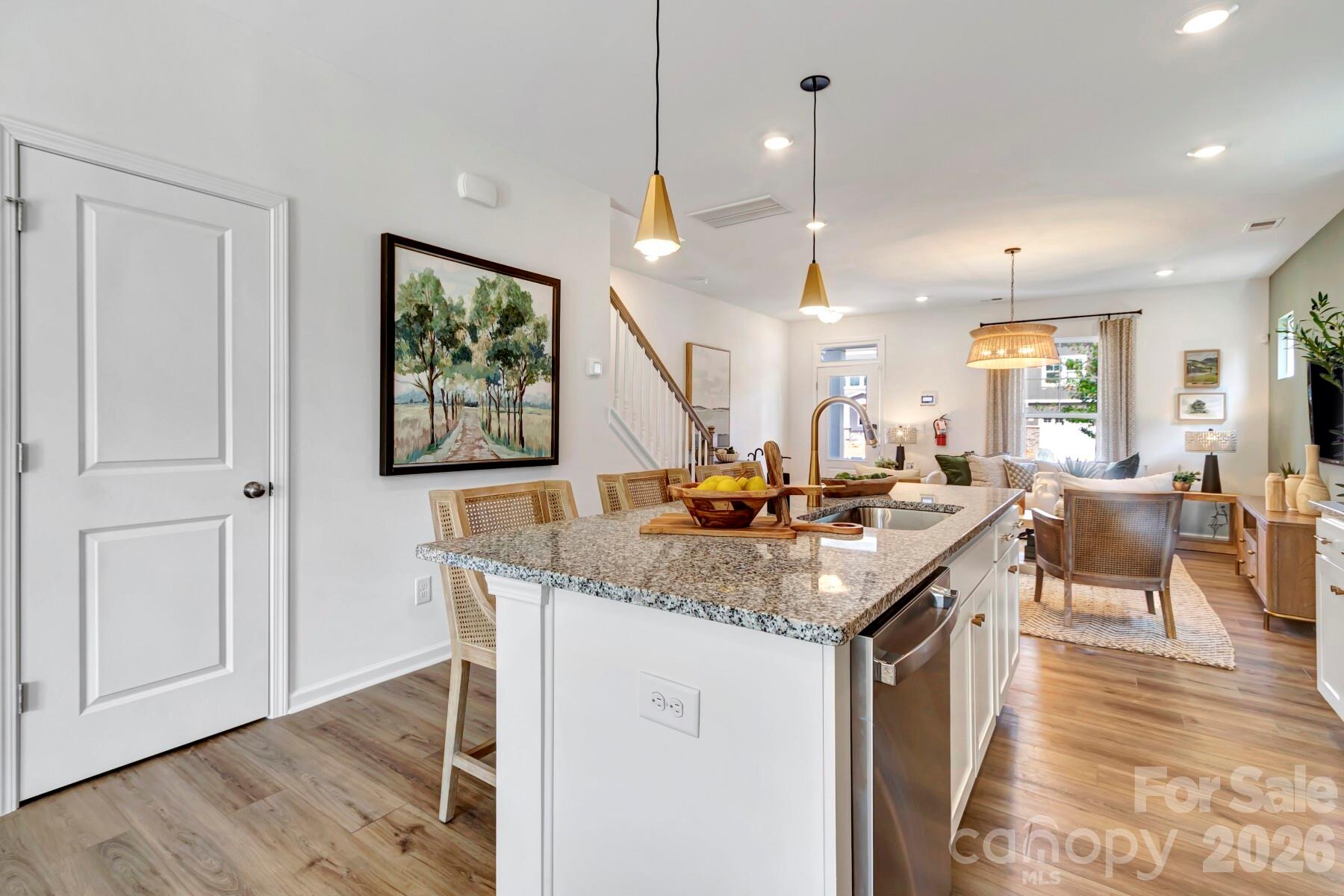 1452 Kate Cecil Way York, SC 29745 - Photo 9 of 27 a kitchen with a stove and a wooden floor
