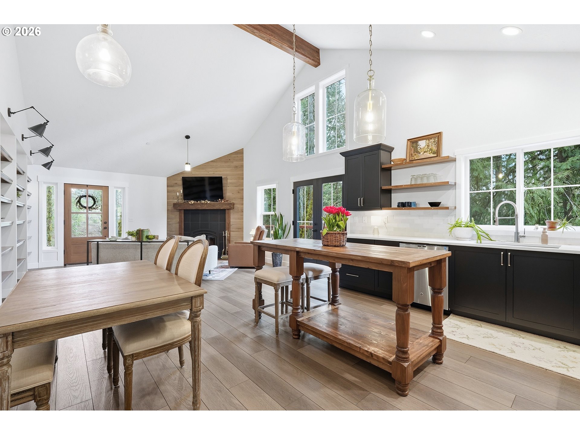 15680 South Wave Road Mulino, OR 97042 - Photo 11 of 43 a living room with furniture a flat screen tv and a table