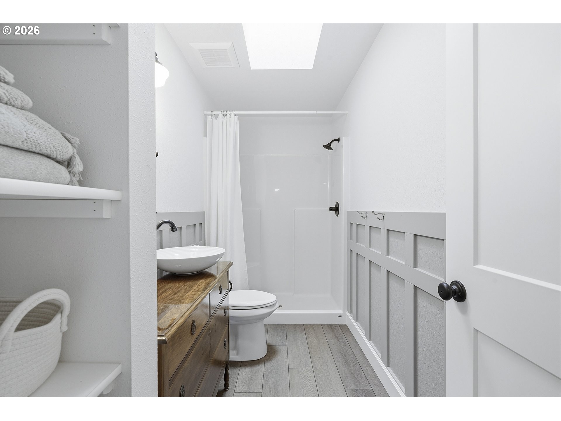 15680 South Wave Road Mulino, OR 97042 - Photo 15 of 43 a bathroom with a toilet a sink and a shower