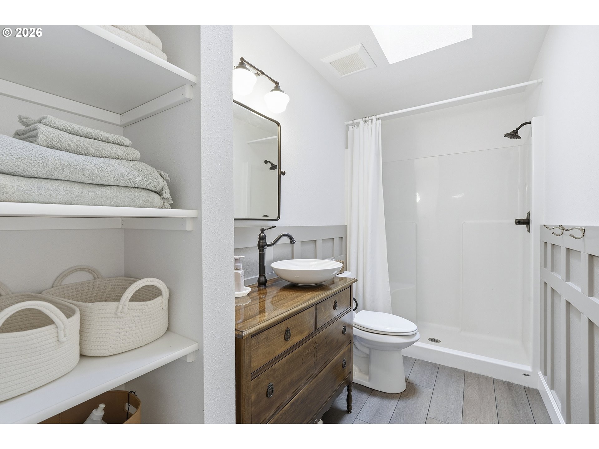 15680 South Wave Road Mulino, OR 97042 - Photo 16 of 43 a bathroom with a granite countertop toilet a sink and a mirror