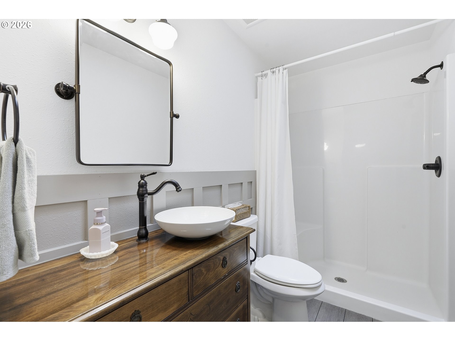 15680 South Wave Road Mulino, OR 97042 - Photo 17 of 43 a bathroom with a sink a toilet and shower