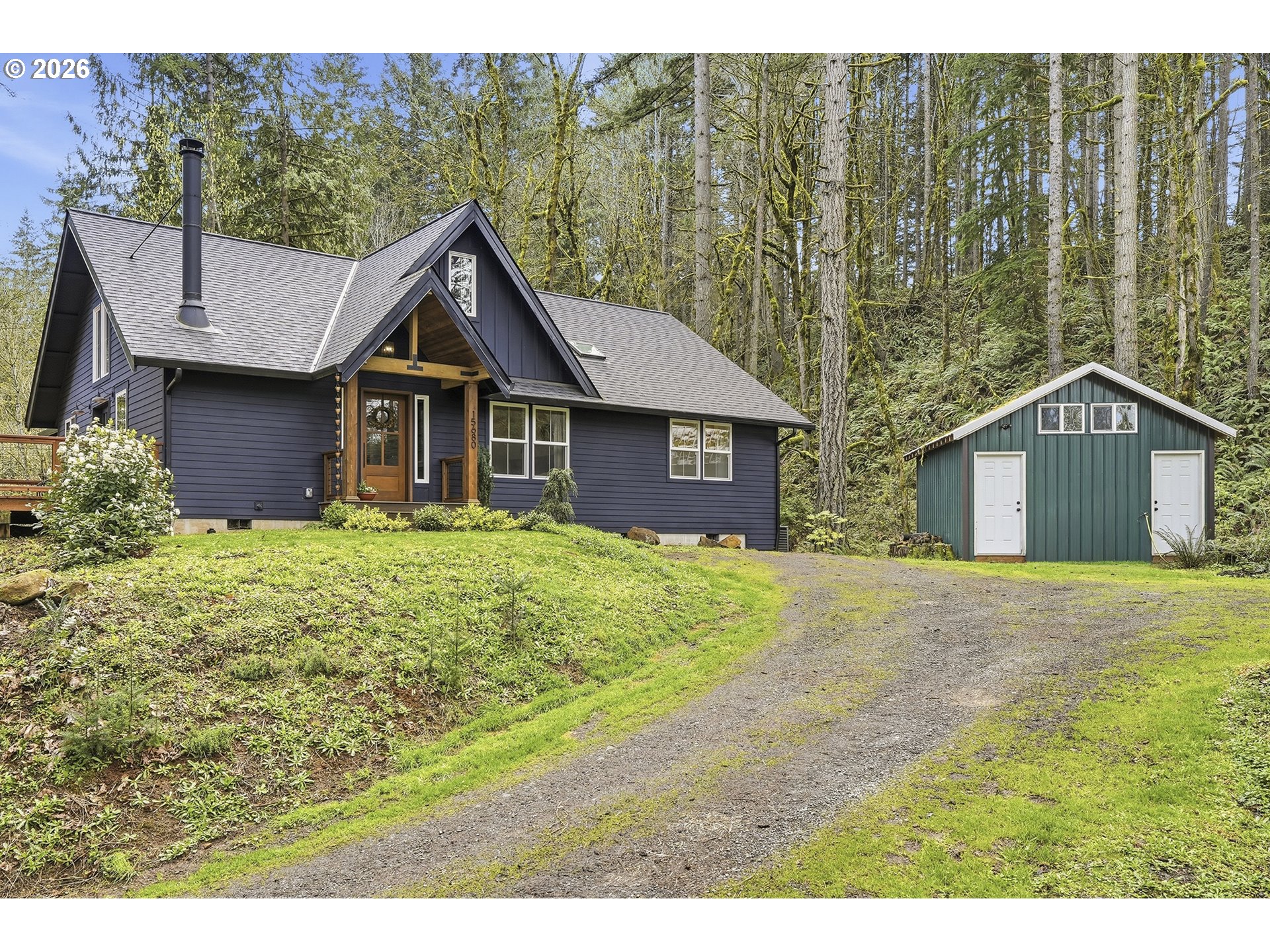 15680 South Wave Road Mulino, OR 97042 - Photo 2 of 43 a house view with a garden space