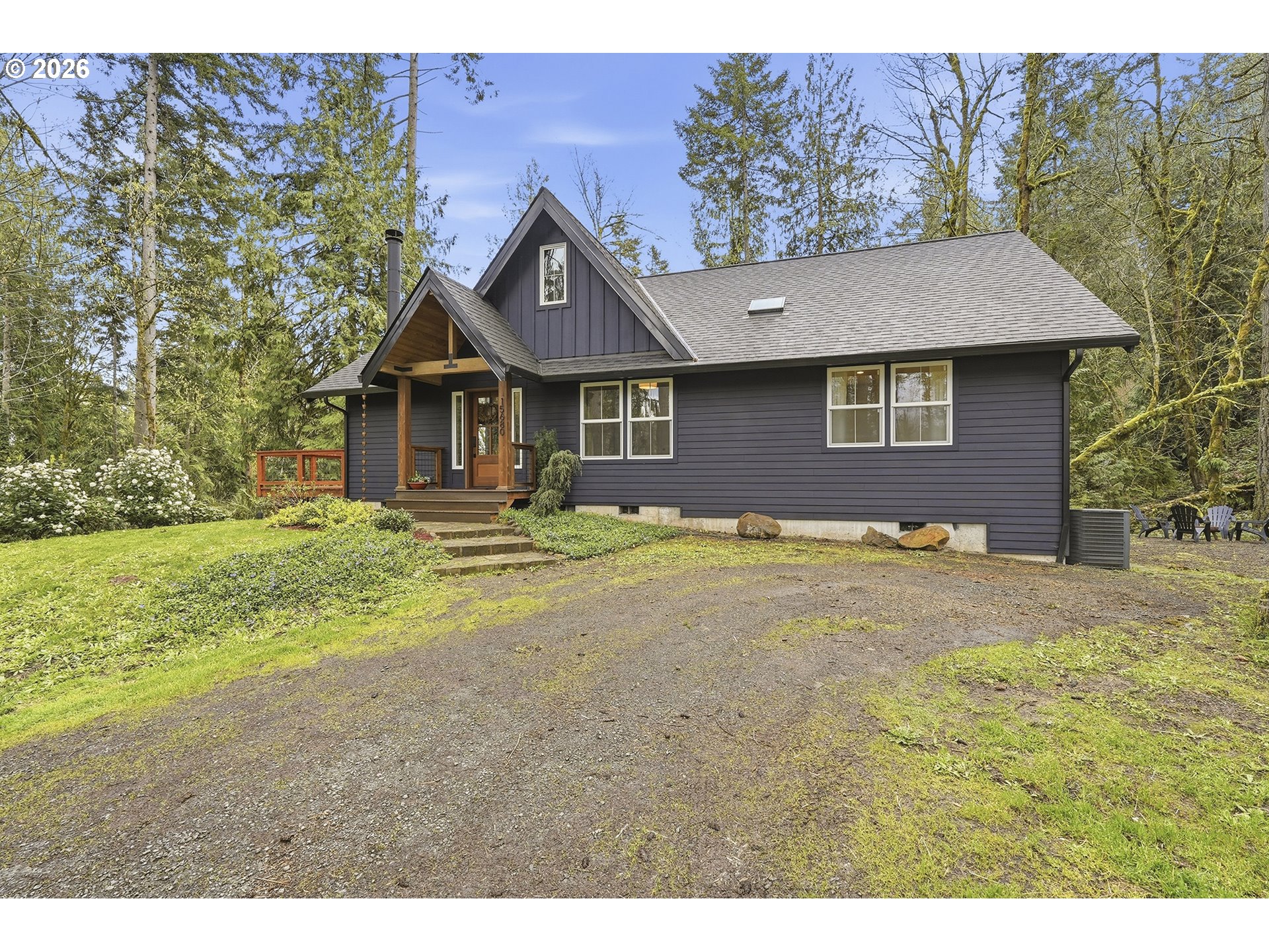 15680 South Wave Road Mulino, OR 97042 - Photo 3 of 43 a front view of a house with garden