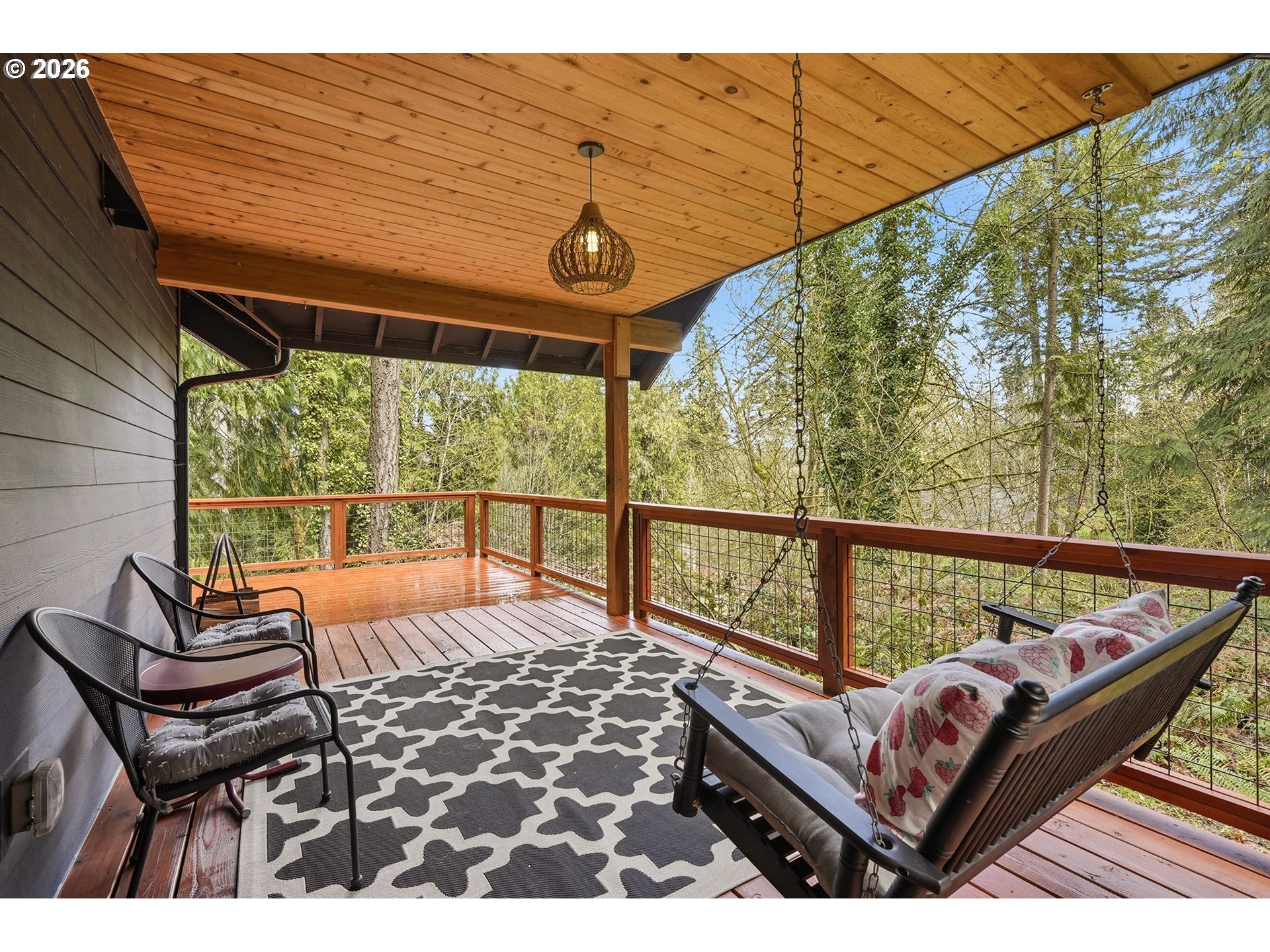 15680 South Wave Road Mulino, OR 97042 - Photo 34 of 43 a balcony with wooden floor and outdoor seating
