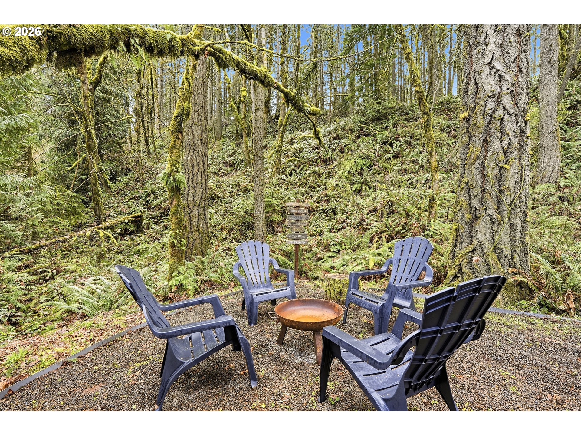 15680 South Wave Road Mulino, OR 97042 - Photo 37 of 43 a backyard of a house with table and chairs
