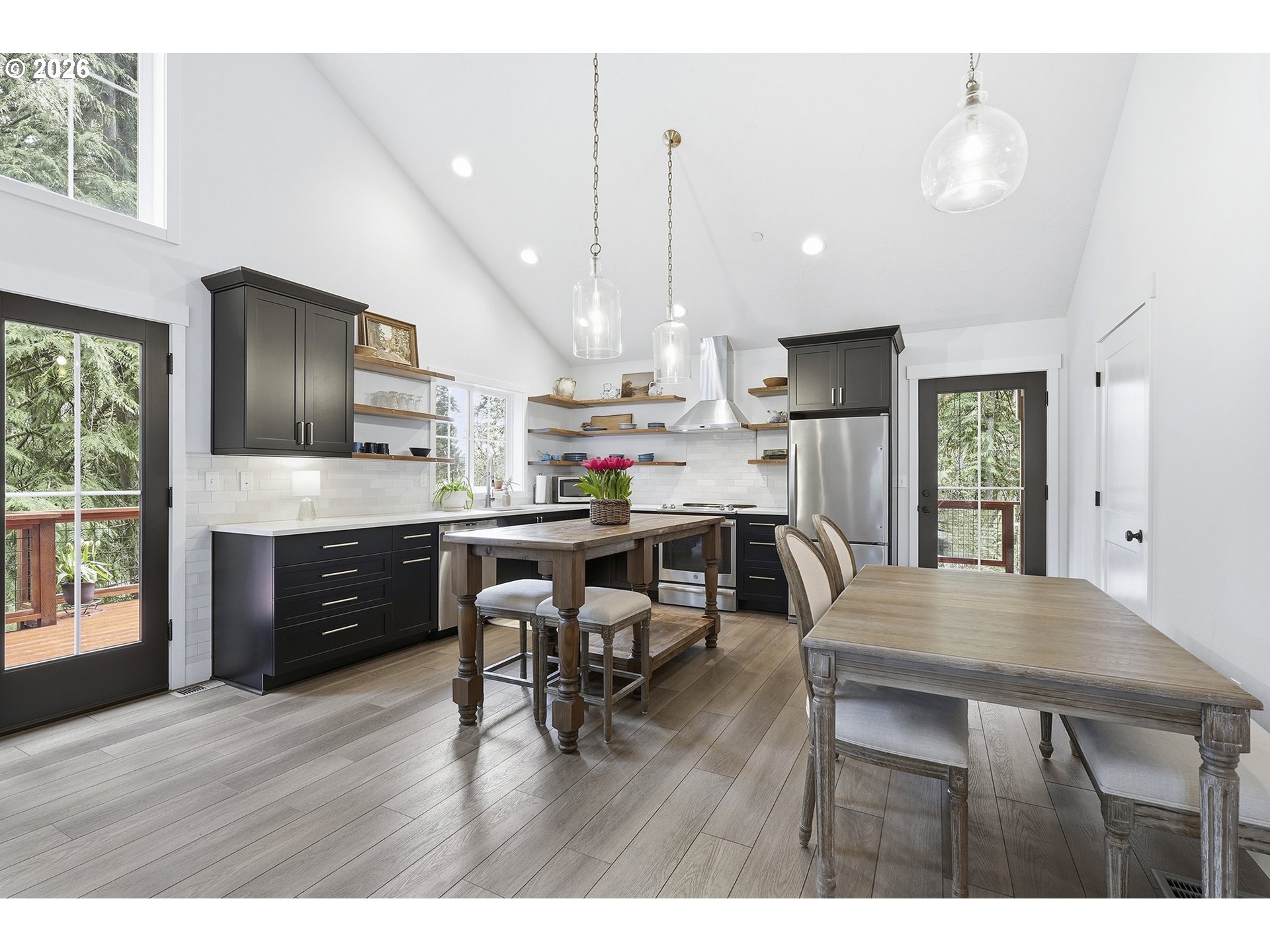 15680 South Wave Road Mulino, OR 97042 - Photo 7 of 43 a living room with stainless steel appliances kitchen island granite countertop furniture wooden floor and a view of kitchen