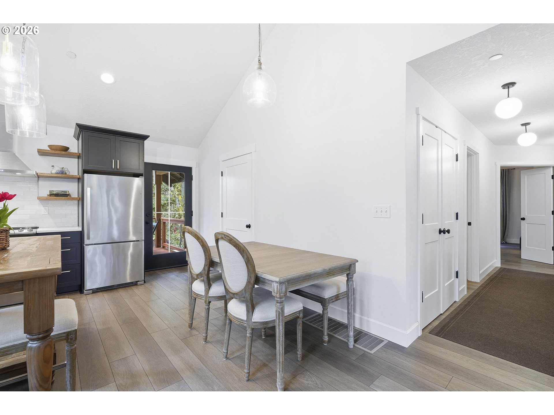 15680 South Wave Road Mulino, OR 97042 - Photo 8 of 43 a view of kitchen with refrigerator and wooden floor