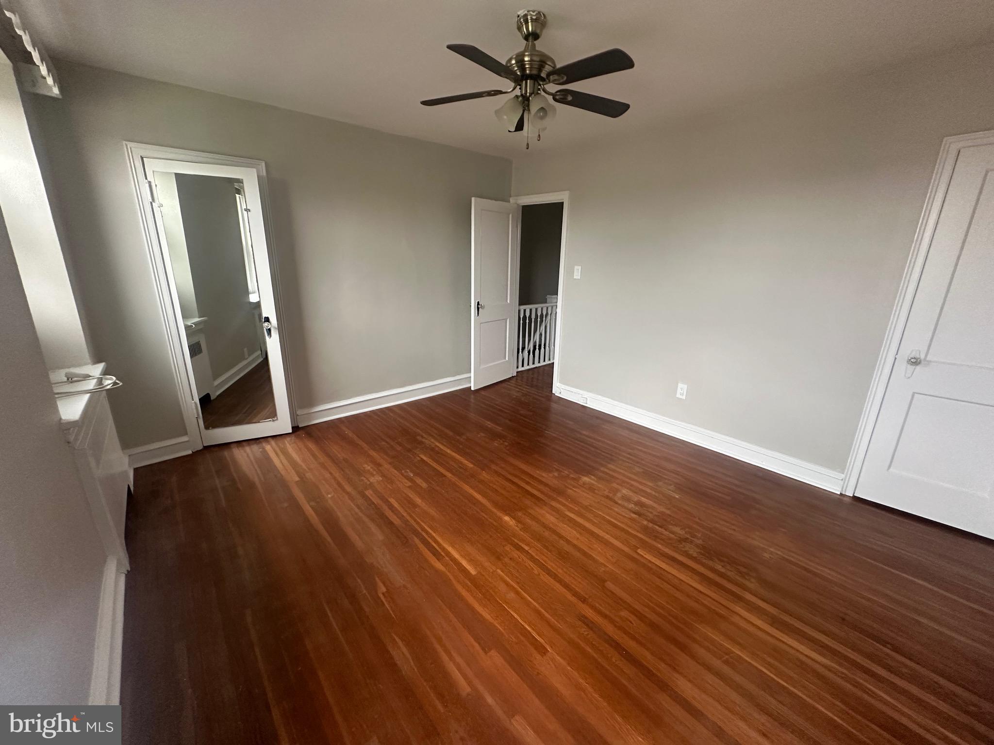 1440 Stirling Street Philadelphia, PA 19149 - Photo 11 of 18 a view of a livingroom with wooden floor and a ceiling fan