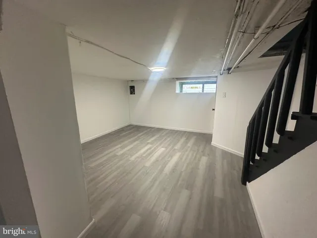 a kitchen with granite countertop a stove and a microwave