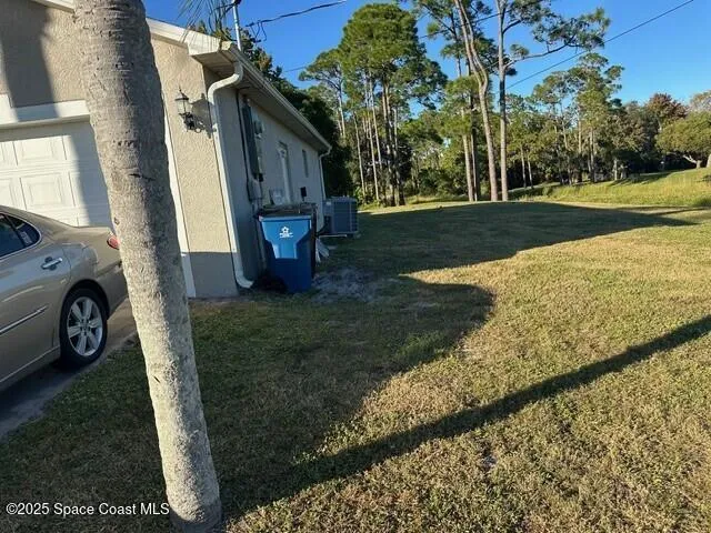 a view of backyard with seating space