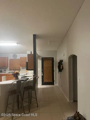 a room with furniture a mirror and entryway