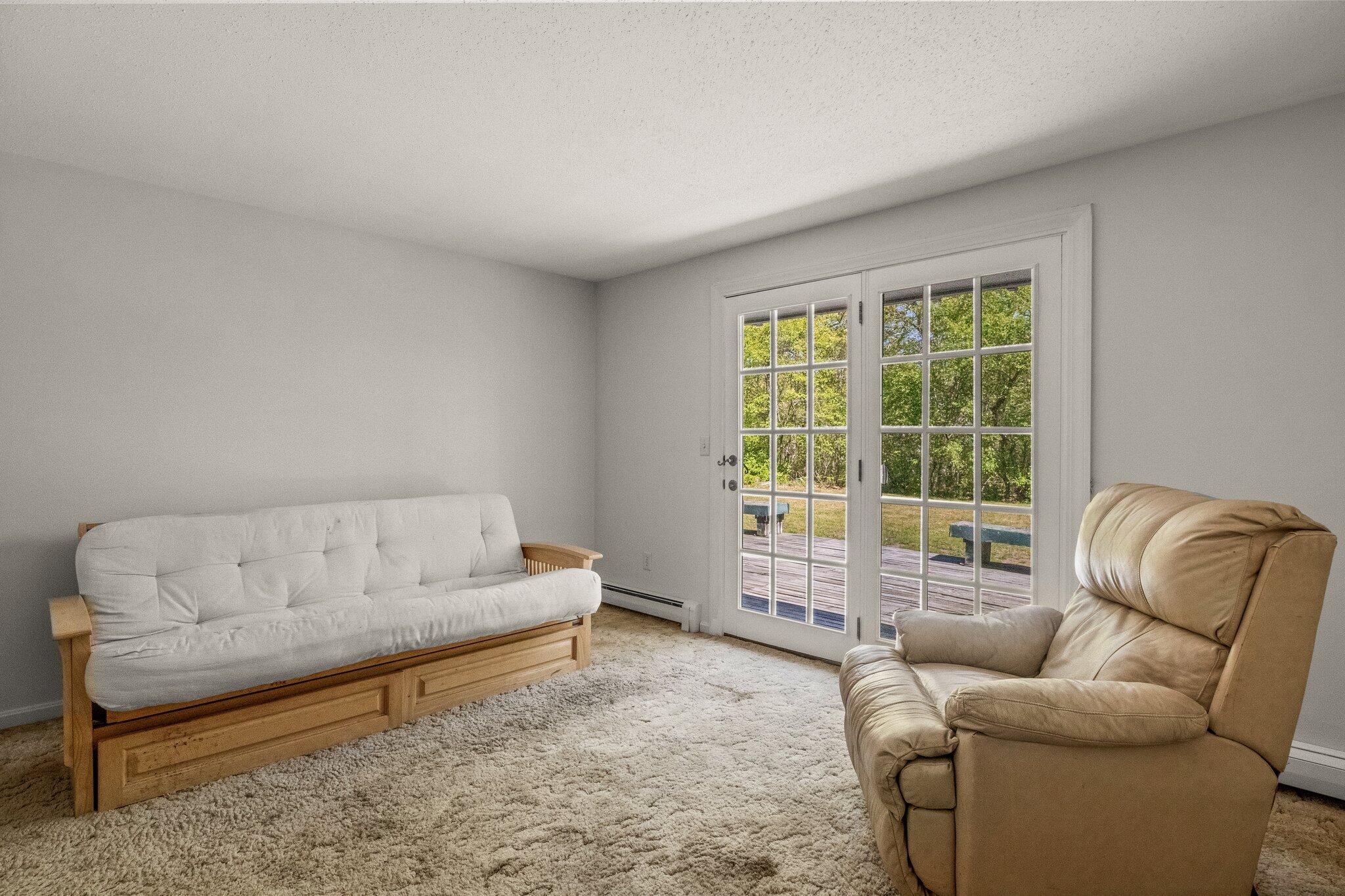 472 Elliott Road Centerville, MA 02632 - Photo 17 of 36 a living room with furniture and a large window