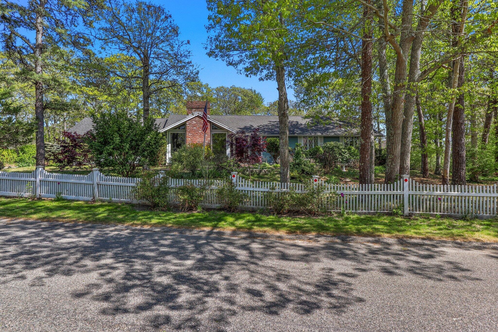 472 Elliott Road Centerville, MA 02632 - Photo 2 of 36 a small garden in the middle of a yard