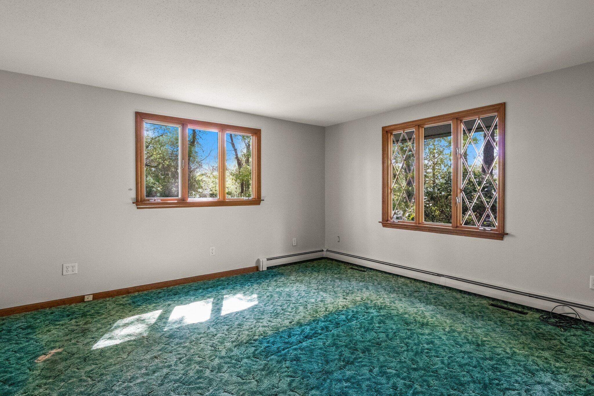 472 Elliott Road Centerville, MA 02632 - Photo 21 of 36 a view of an empty room with window and hardwood floor