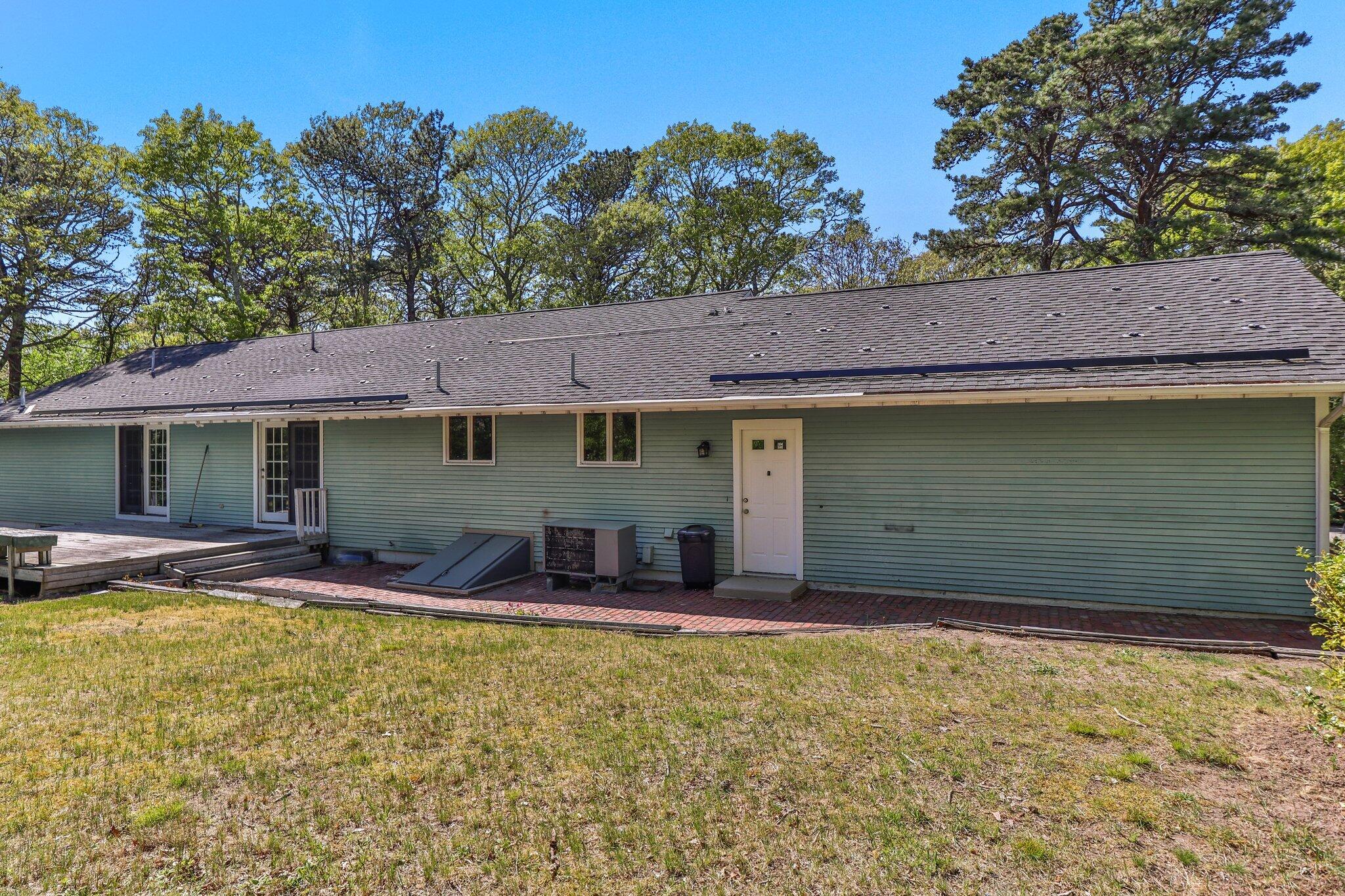 472 Elliott Road Centerville, MA 02632 - Photo 30 of 36 a view of house with outdoor space and swimming pool