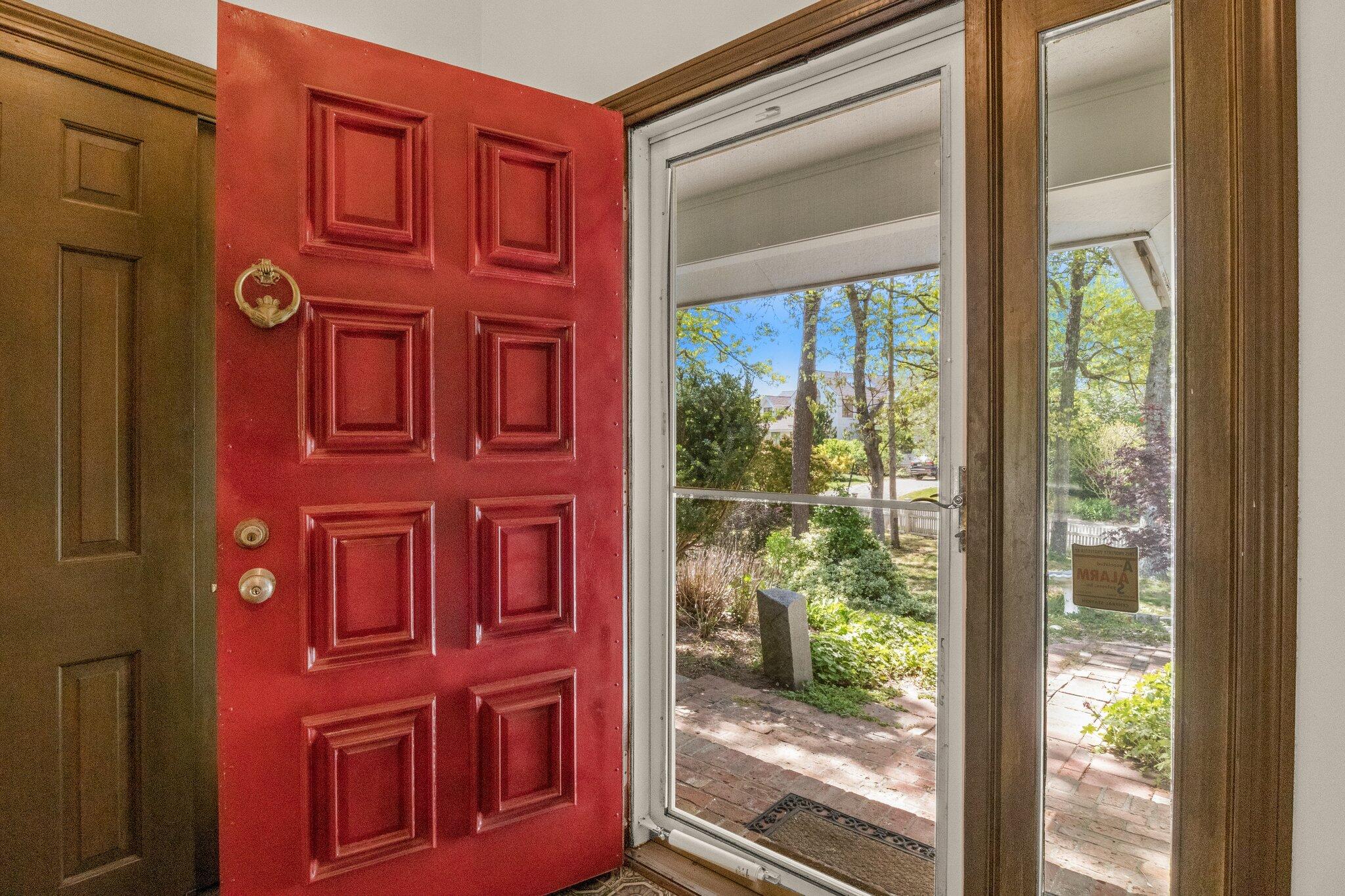 472 Elliott Road Centerville, MA 02632 - Photo 5 of 36 a view of a brick building with a large window