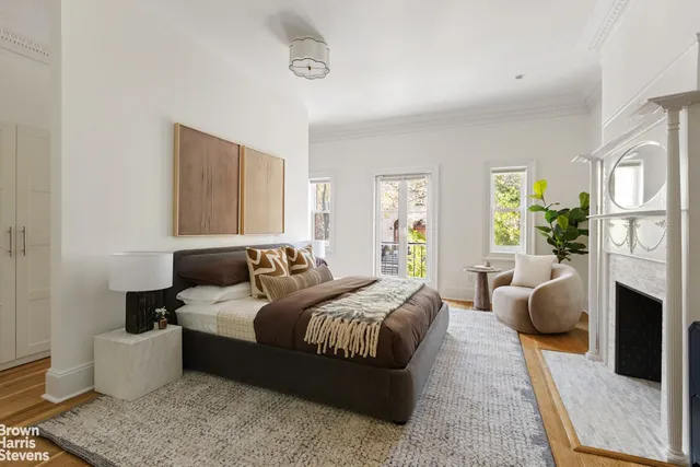 a bedroom with furniture and a window