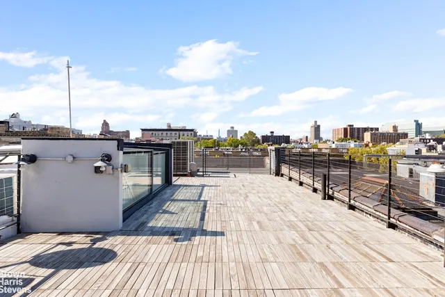 a bathroom with a granite countertop toilet sink and mirror