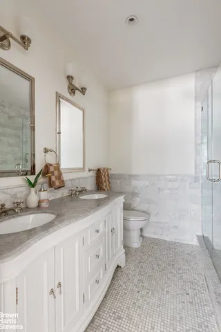 a spacious bedroom with a bed and a couch