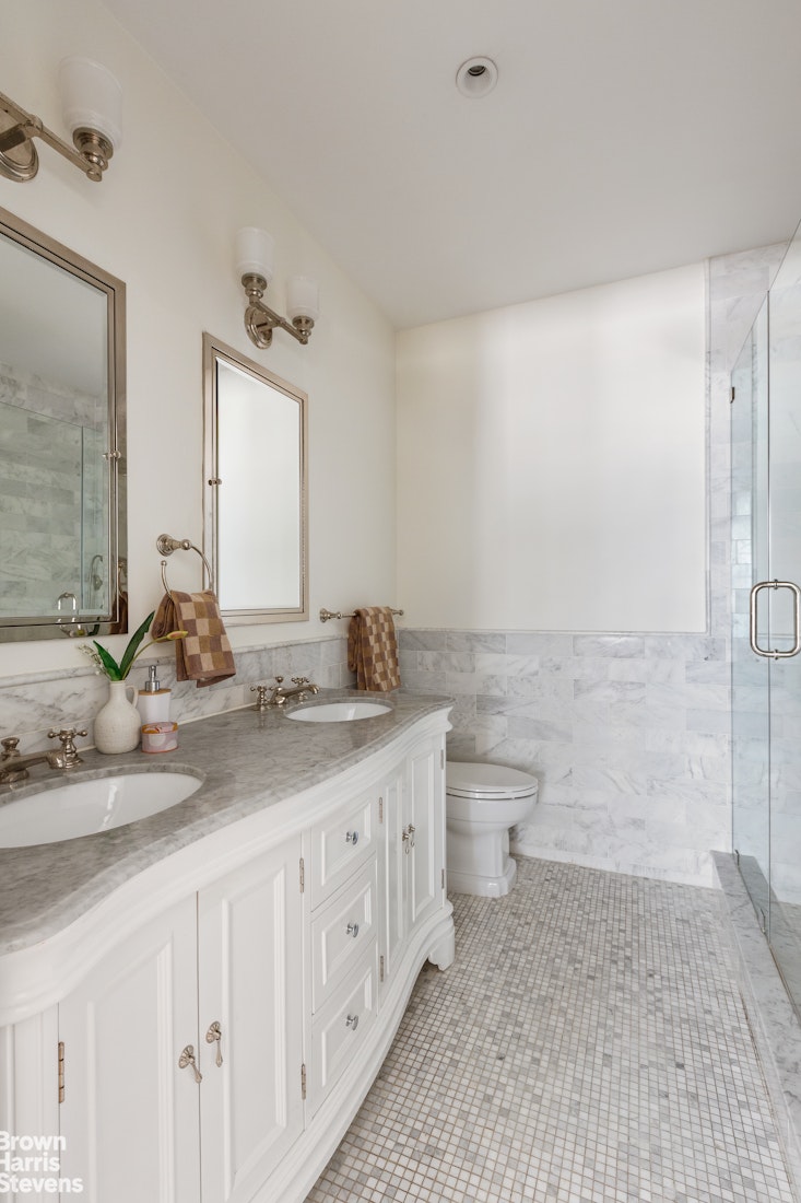 209 West 139th Street Manhattan, NY 10030 - Photo 8 of 14 a bathroom with a granite countertop sink a toilet and a mirror