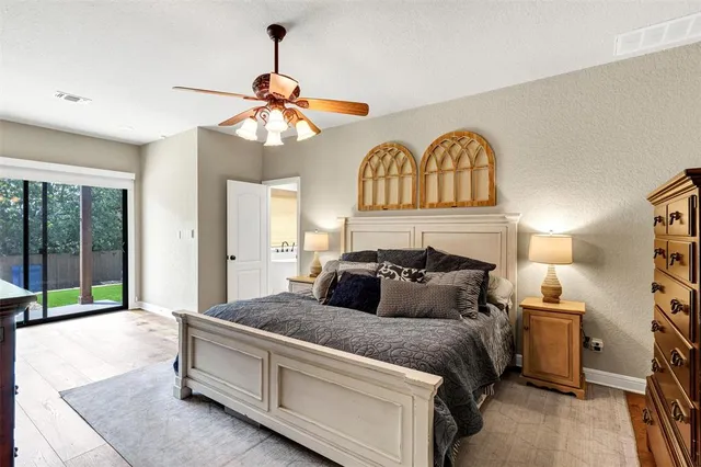 a bedroom with bed and a window