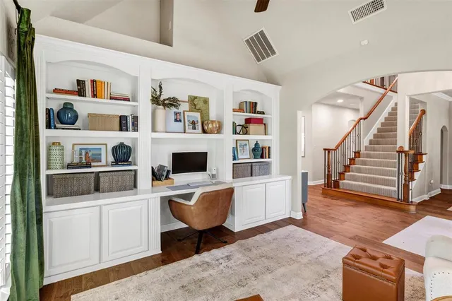 a workspace with furniture and stairs