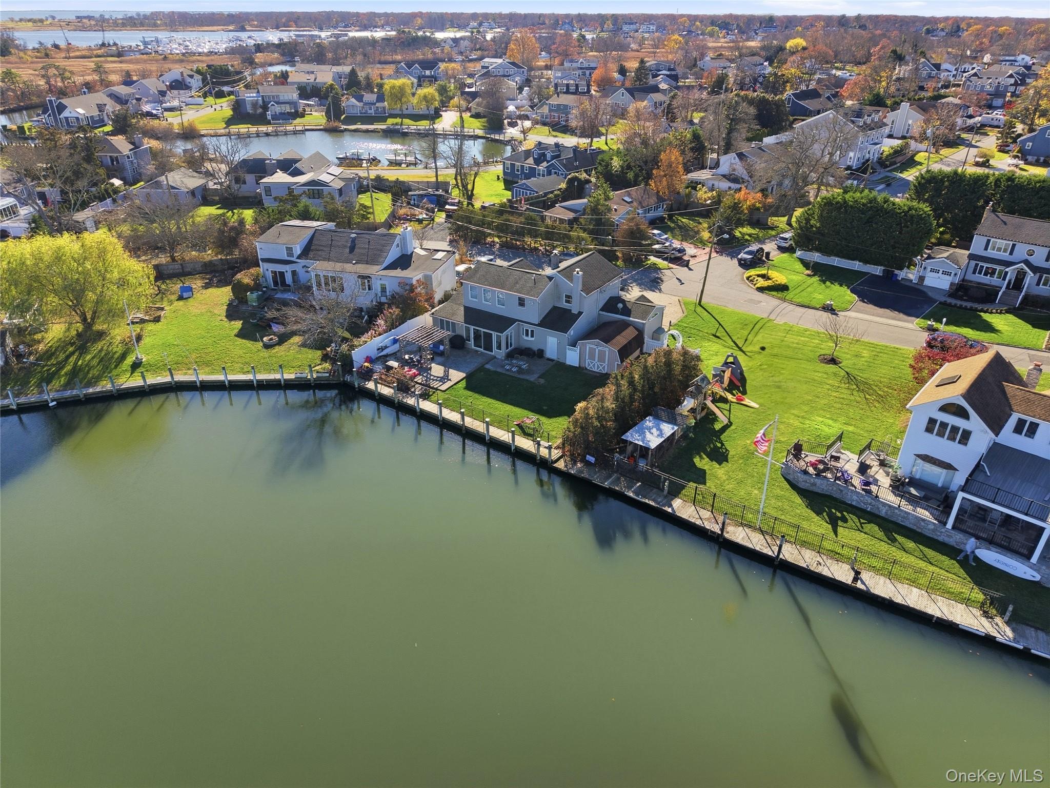Aerial view of residential area with a nearby body of water