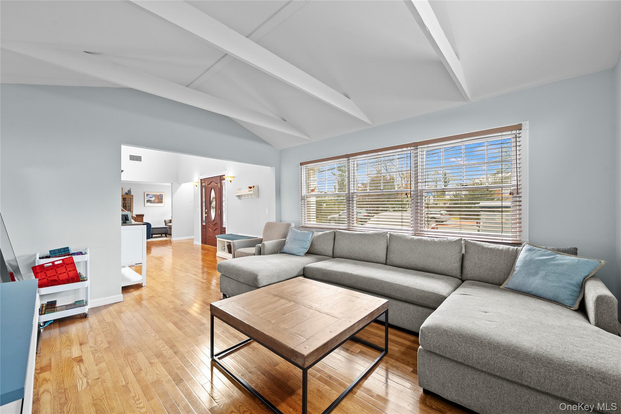 625 Edgewater Road Oakdale, NY 11769 - Photo 23 of 49 Living room featuring light wood-style floors and baseboards