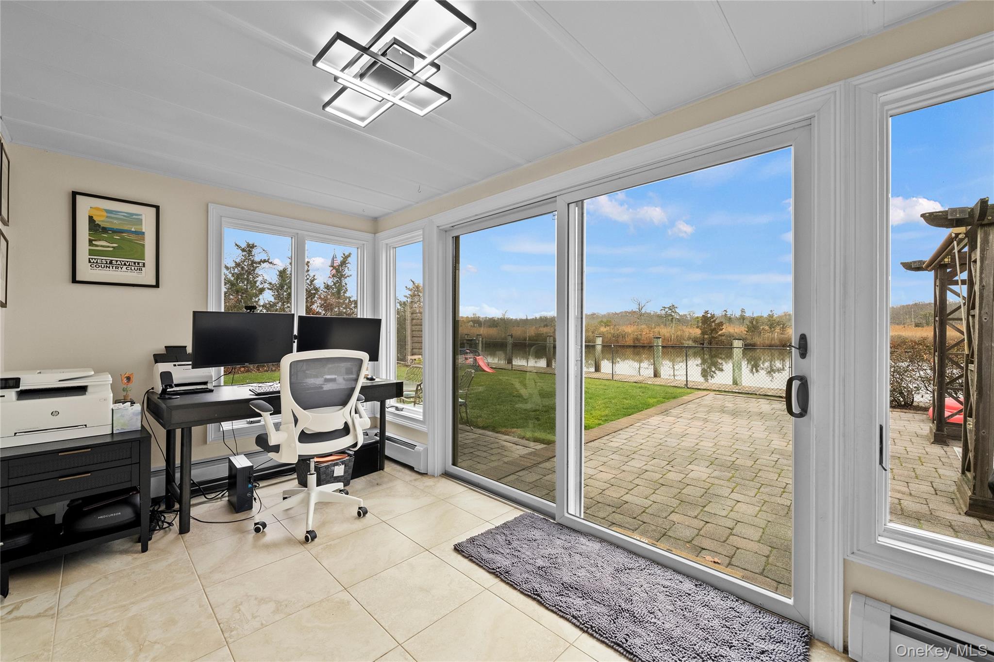 625 Edgewater Road Oakdale, NY 11769 - Photo 24 of 49 Office with a baseboard radiator and light tile patterned flooring
