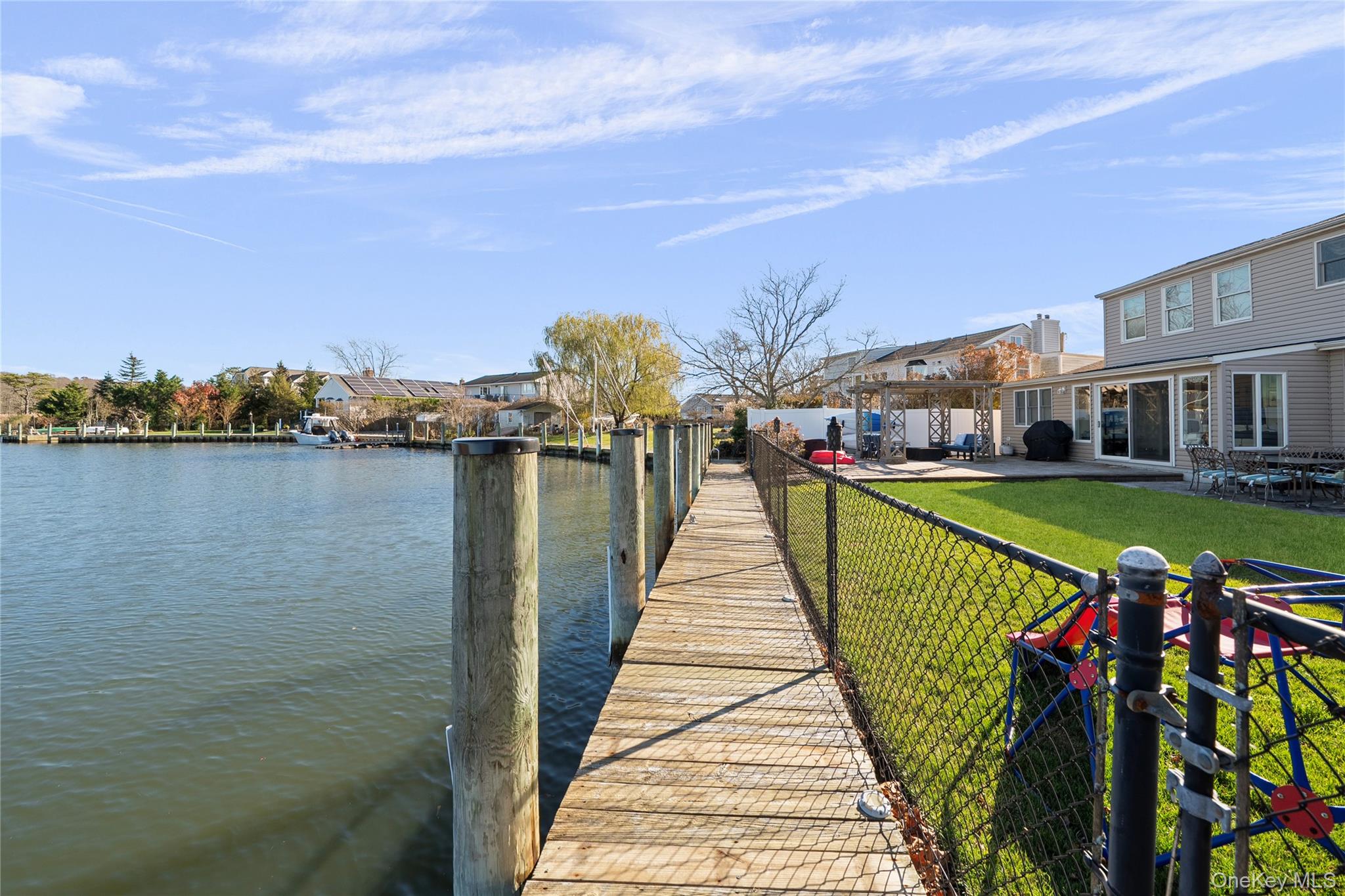 625 Edgewater Road Oakdale, NY 11769 - Photo 40 of 49 Dock with a patio and a water view