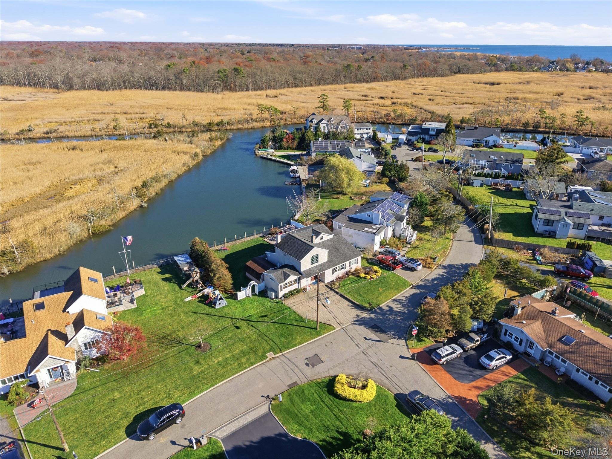 625 Edgewater Road Oakdale, NY 11769 - Photo 45 of 49 Aerial view of residential area with a large body of water