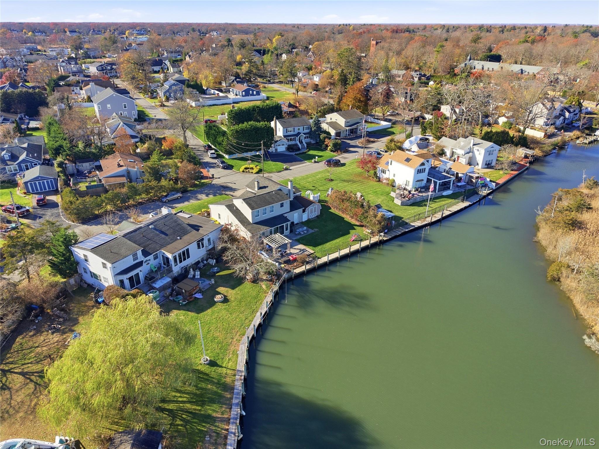 625 Edgewater Road Oakdale, NY 11769 - Photo 46 of 49 Aerial perspective of suburban area with a large body of water
