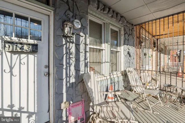 a view of a house with a door and wooden floor