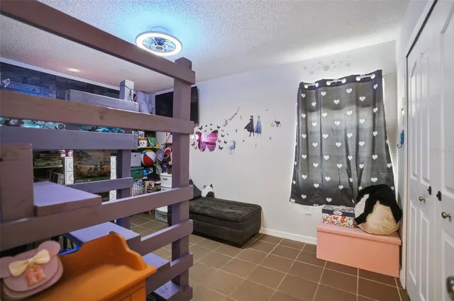 a room with furniture and musical instruments