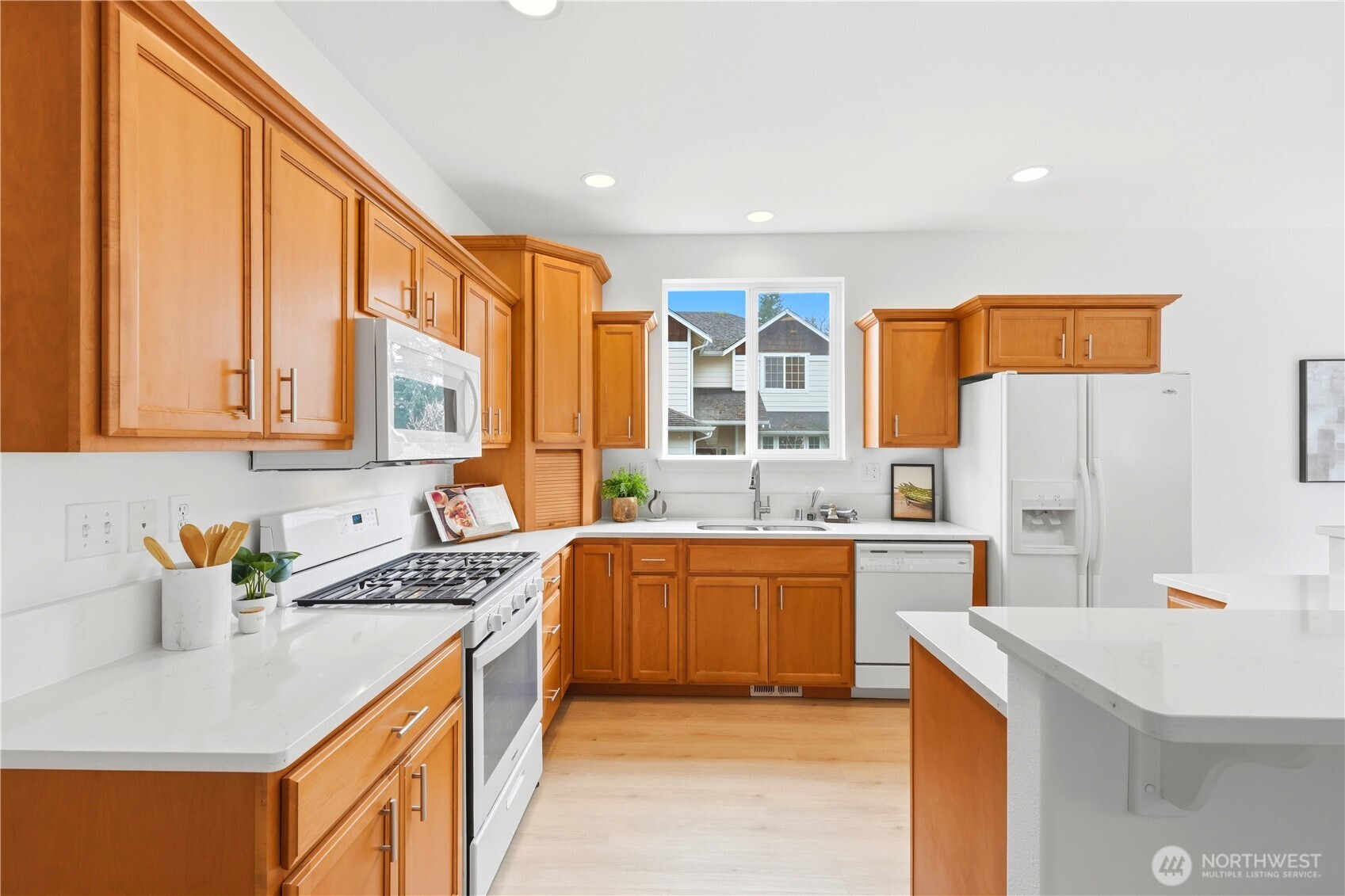 24115 22nd Place West Bothell, WA 98021 - Photo 14 of 40 a kitchen with stainless steel appliances granite countertop a sink stove and refrigerator